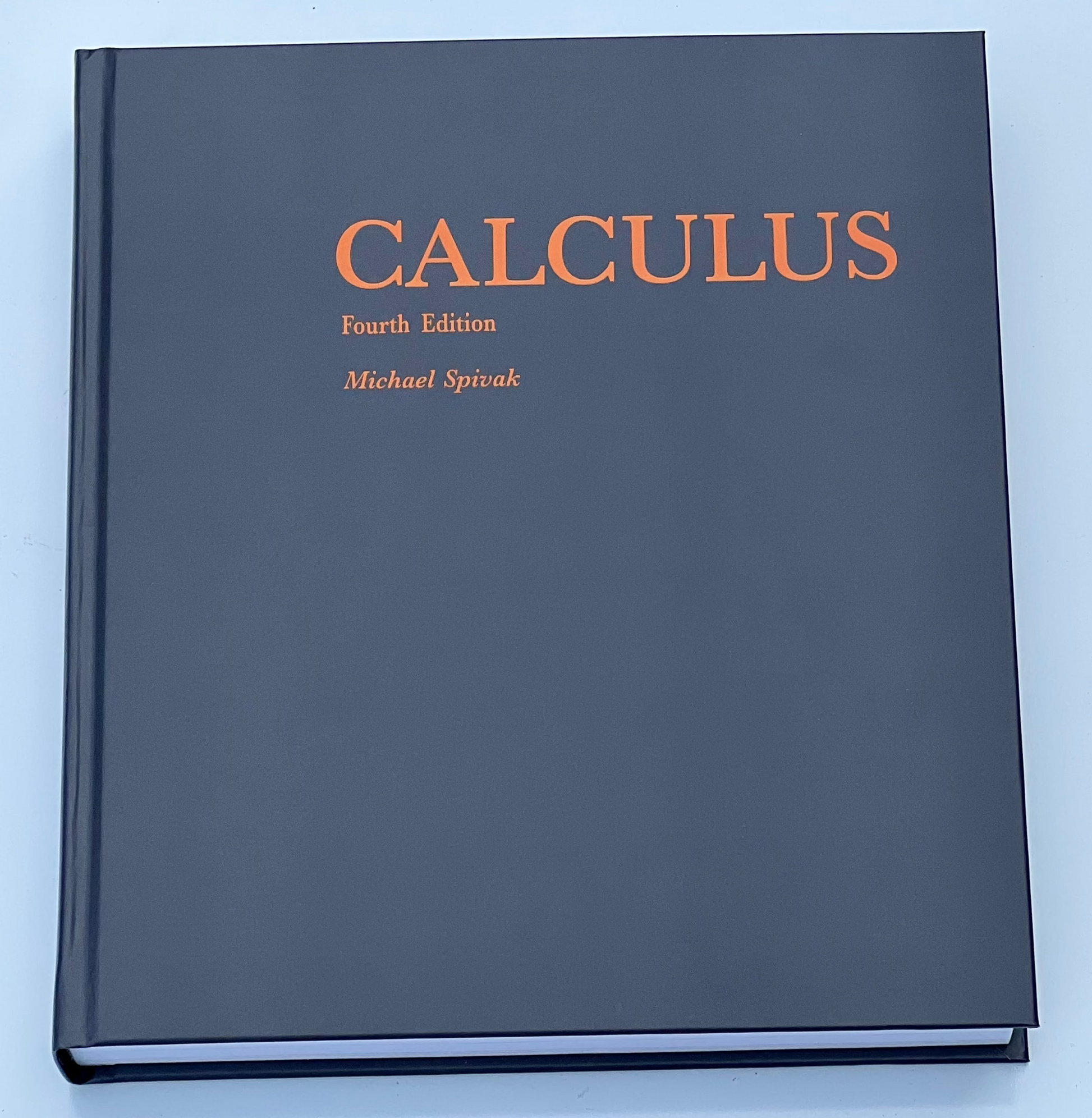 Live image of Calculus 4th Edition by Michael Spivak, showing the front cover and some of the book block with a slight angle.